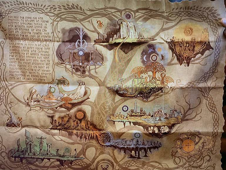 Imagem do mapa de pano com os nove reinos de God of War Ragnarok, presente na Jotnar edition do jogo