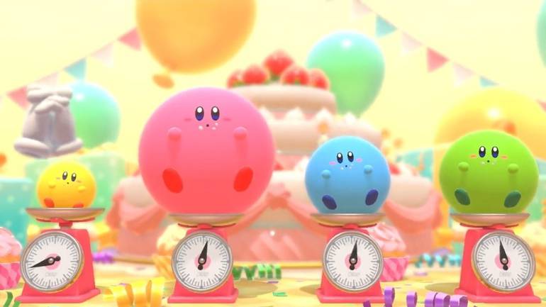Cena do trailer de Kirby's Dream Buffet mostra quatro Kirbys gordinhos em balanças. Ao final de cada fase, o Kirby que comer mais e estiver mais pesado vence.