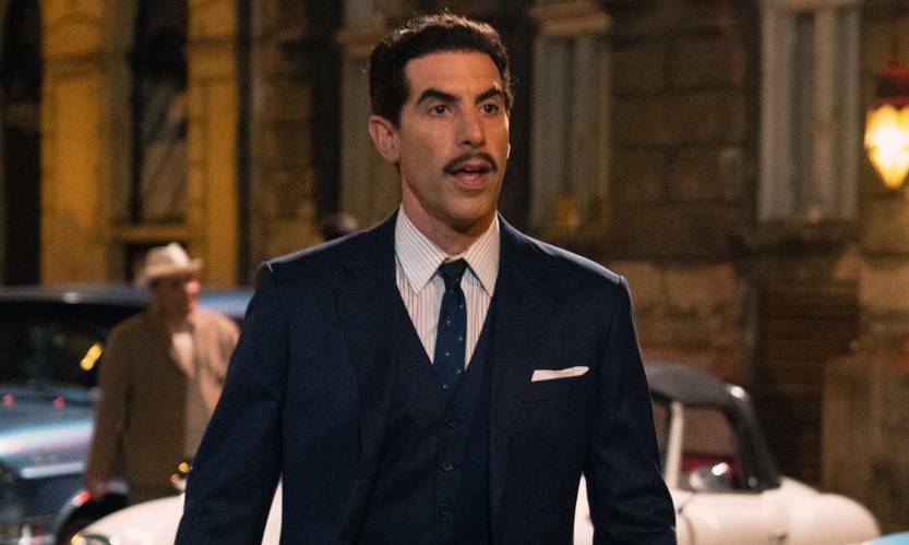 Sacha Baron Cohen em cena de O Espião (Reprodução)
